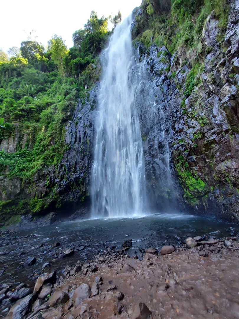 Close view of Materuni Waterfalls pouring into its pool
